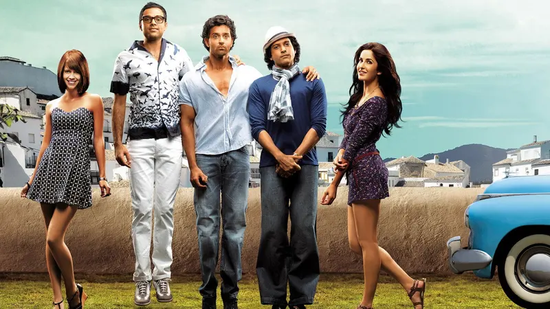 The cast of Zindagi Na Milegi Dobara posing beside a vintage car in the Spanish countryside