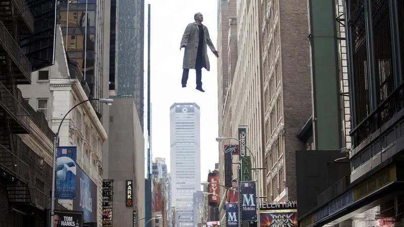 Michael Keaton's character floating above a busy Times Square street in Birdman