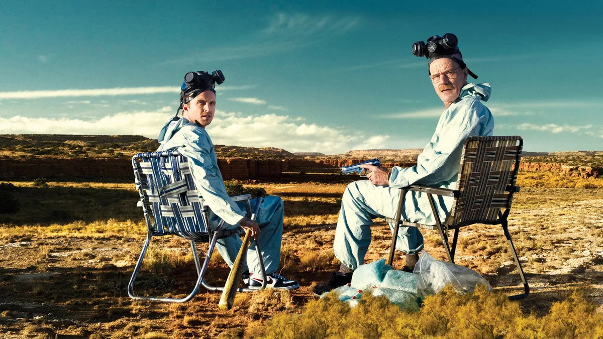 Bryan Cranston and Aaron Paul sitting in lawn chairs in the New Mexico desert in Breaking Bad