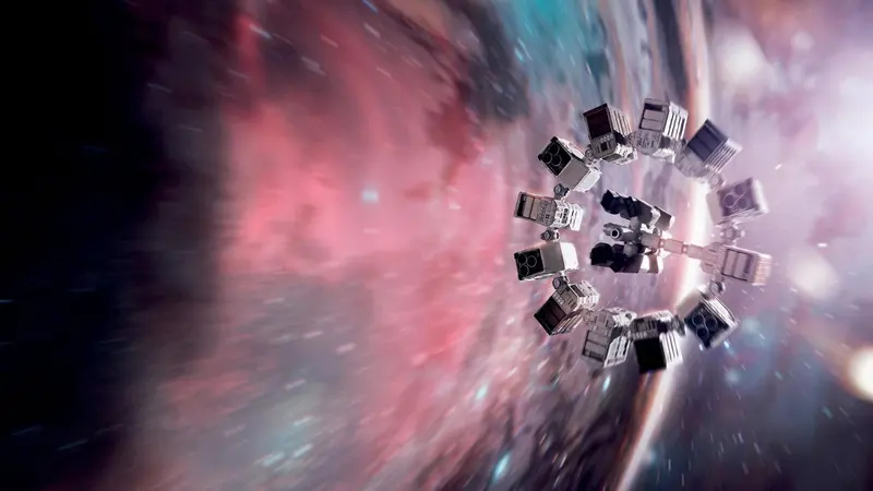 The Endurance spacecraft approaching a glowing wormhole in Interstellar